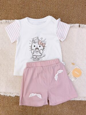 White cartoon-cat short-sleeve top with pink striped sleeves, paired with pink shorts featuring striped bow details.