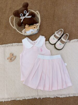 Pale pink and white fine-check sleeveless top with a white Peter Pan collar and pink horse-and-rider motif, paired with a fine-check pleated skirt with a white waistband.