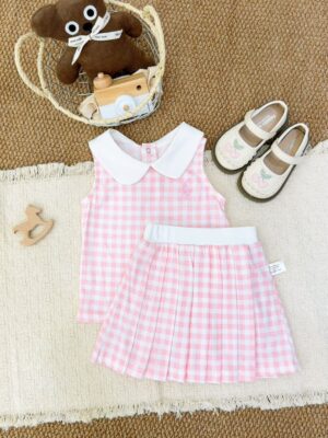 Pink and white gingham sleeveless top with a white Peter Pan collar and pale pink horse-and-rider motif, with a matching pleated skirt and white waistband laid in front.