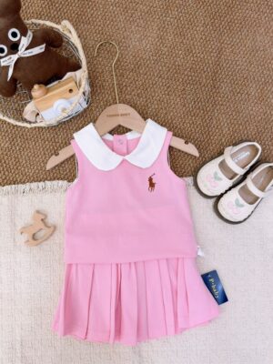 Pink sleeveless top layered over a pink pleated skirt, with a white Peter Pan collar and brown horse-and-rider motif.