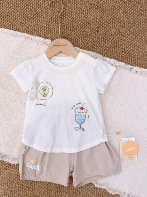 White round-neck short-sleeved top with cookie and blue milkshake graphics, paired with greige gathered-hem shorts featuring a yellow star and Cute lettering.