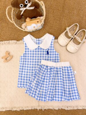 Blue and white gingham sleeveless top and pleated skirt, with a white Peter Pan collar, white waistband and a dark blue horse-and-rider chest motif.