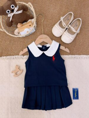 Navy sleeveless top layered over a matching pleated skirt, with a white Peter Pan collar and a red horse-and-rider chest motif.